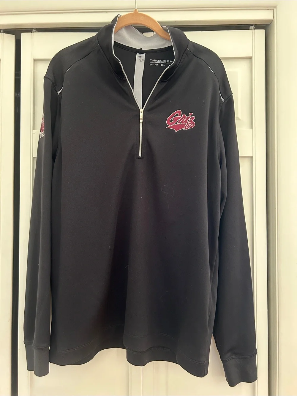 University of Montana Nike Golf Black Quarter-Zip Pullover with maroon Griz Logo